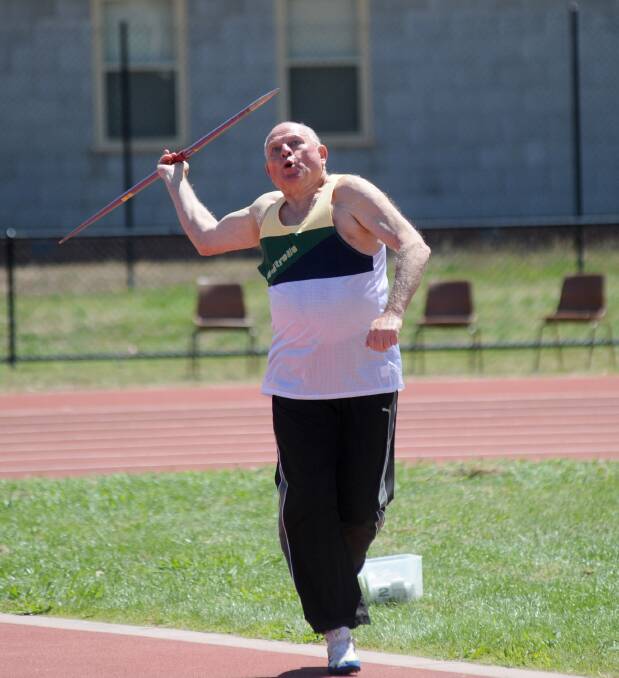 GOLD: Peter Young contests javelin. 