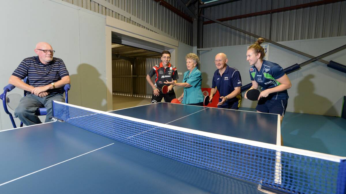HAVING A BALL: Cr Peter Cox sits on the new umpires chair as  table tennis players Ivan Sulfaro, Lola Miller, Gary Warnest and Melissa Tapper test out the new table at Neil Pollock Stadium in Eaglehawk. Picture: JIM ALDERSEY