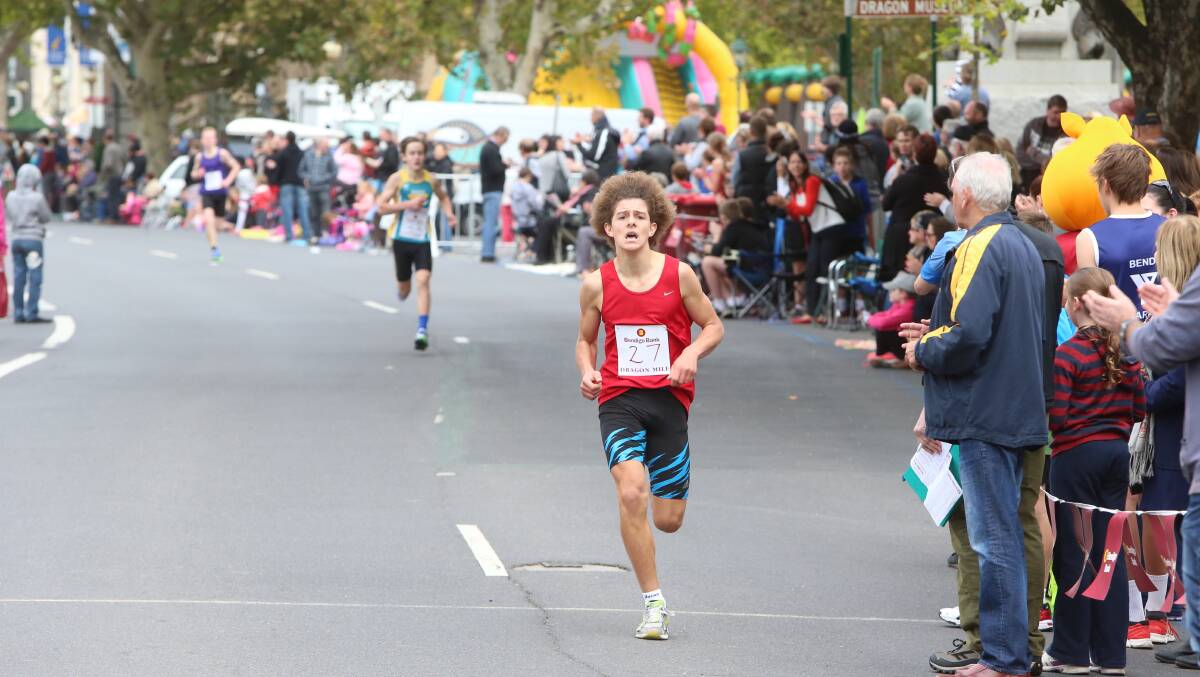 Luke Padgham from Catholic College Bendigo sprints to victory in the years 7-8 boys race at the Bendigo Bank Dragon Mile. 