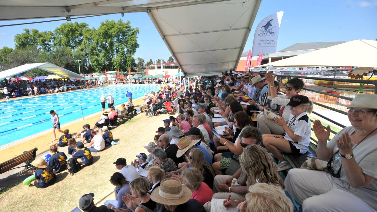 Fans enjoy the shade at the 2012 country titles at Bendigo Aquatic Centre. 