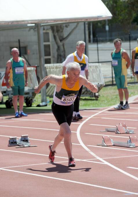 DASH: Jim Sinclair warms up for the 85-89 years 100m. 