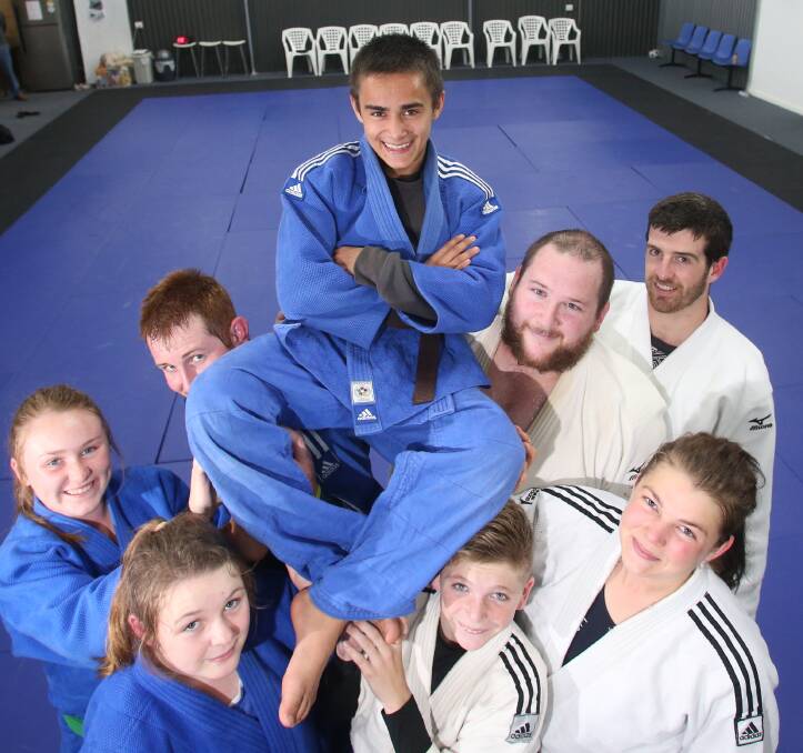 GREAT SUPPORT: Judo champion Bryan Jolly is hoisted high by Judo Bendigo clubmates in the lead-up to major tournaments. Picture: GLENN DANIELS