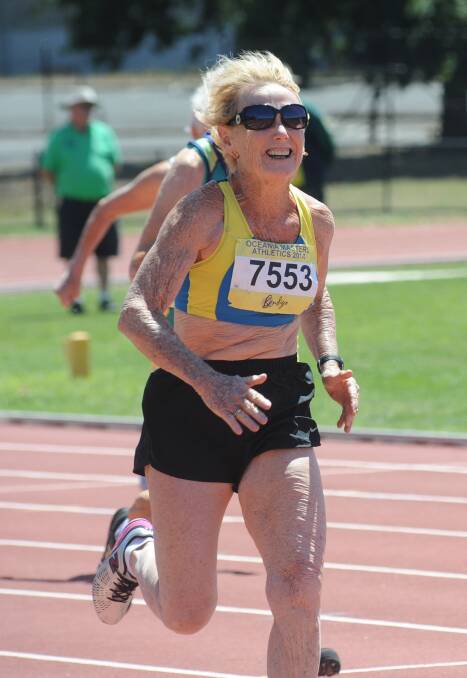 COOK FIRES: Kathleen Cook sprints to victory in the 75-79 years 100m. 