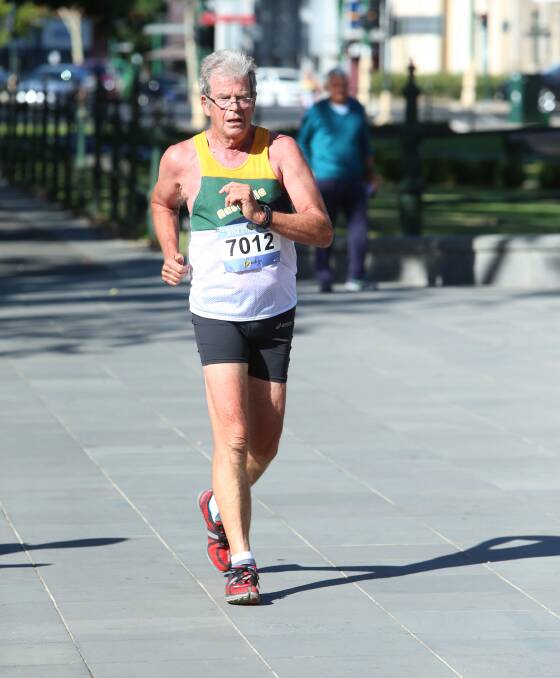 COUPLE STEPS TO GO: Tony Johnson powers to the finish of the 10km walk at the Oceania Masters athletics championships in Bendigo. 