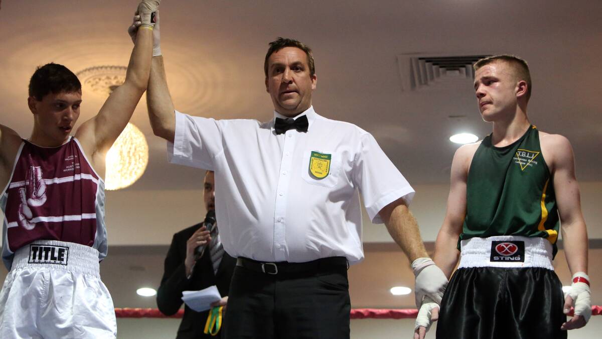 GOLD: Queensland's Luke Humphries wins the junior 60kg final against Queensland's Brodie Gregson at the Australian Amateur Boxing League national titles in Bendigo. Picture: LIZ FLEMING