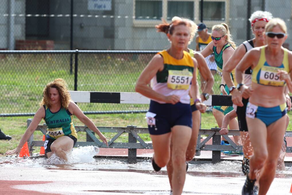 Athletes contest the steeplechase on the final day of track and field competition at the Oceania Masters athletics titles in Bendigo. Picture: LIZ FLEMING 