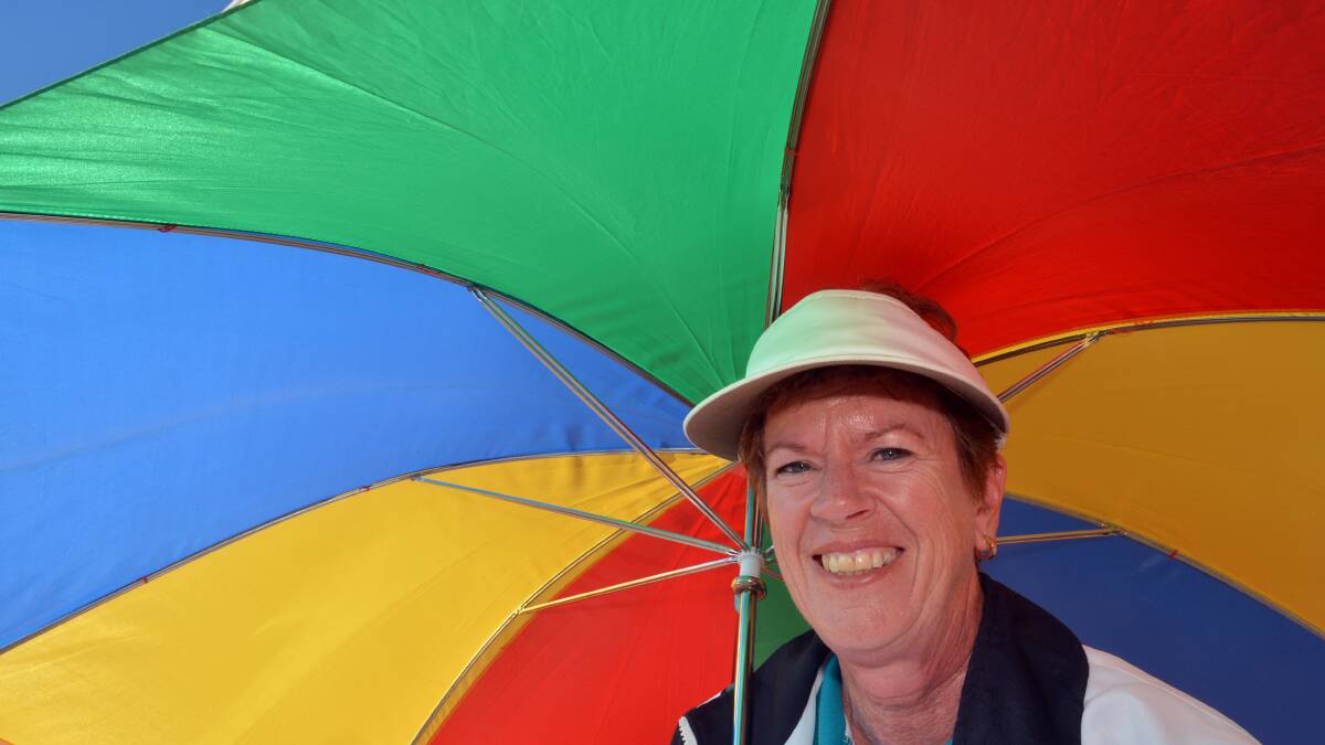 Helen Clough takes shelter from the sun at the Bendigo East greens. 