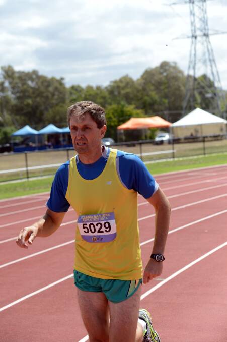 AROUND THE BEND: Tony McGrath competes in the 1500m leg of the decathlon at the Oceania Masters athletics championships in Bendigo. Picture: LIZ FLEMING 