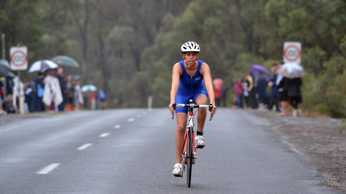 Kate Cassel-Ashton from Victoria contests the cycling leg in the 17-19 years girls championship at Crusoe Reservoir in Kangaroo Flat. Picture: BRENDAN McCARTHY 