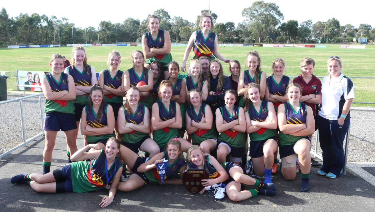 NUMBER ONE: Catholic College Bendigo celebrates after winning the Sandhurst division secondary schools years 7-9 girls football grand final at Flight Centre Park in Strathfieldsaye. CCB will play at the Loddon Mallee finals in August. Picture: PETER WEAVING 