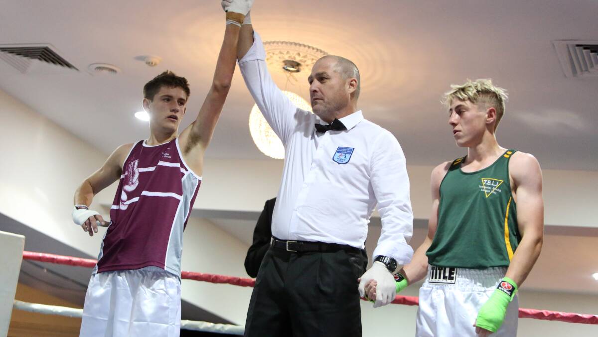 VICTORIOUS: Jayden Morgan is declared the winner of the junior 57kg final against Tasmania's Nick Jordan at the Australian Amateur Boxing League national titles in Bendigo. Picture: LIZ FLEMING