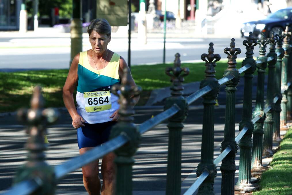 PICTURESQUE: Margaret Trengove walks along Pall Mall in the 10km event at the Oceania Masters athletics championships in Bendigo. Picture: PETER WEAVING 