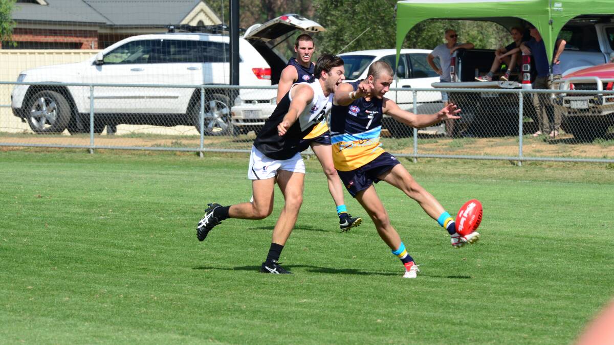 GREAT PASS: Cameron Barrett kicks in the Bendigo Pioneers win against North Ballarat Rebels at Epsom-Huntly. Picture: PETER WEAVING 