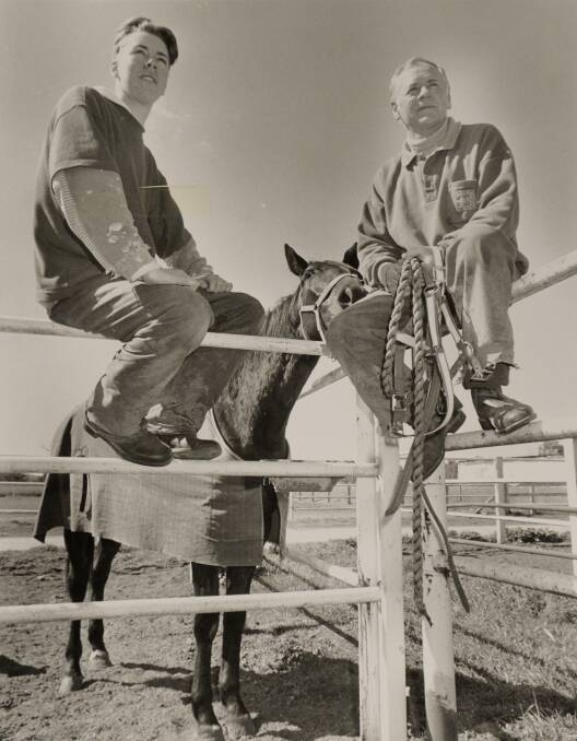Matthew and Brian Gath take a break from work at their Longlea stables. 