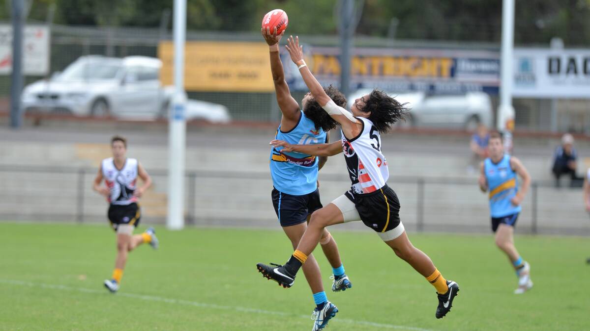 Kayle Kirby from Tyntynder leaps for a mark in Bendigo's clash with Dandenong. 