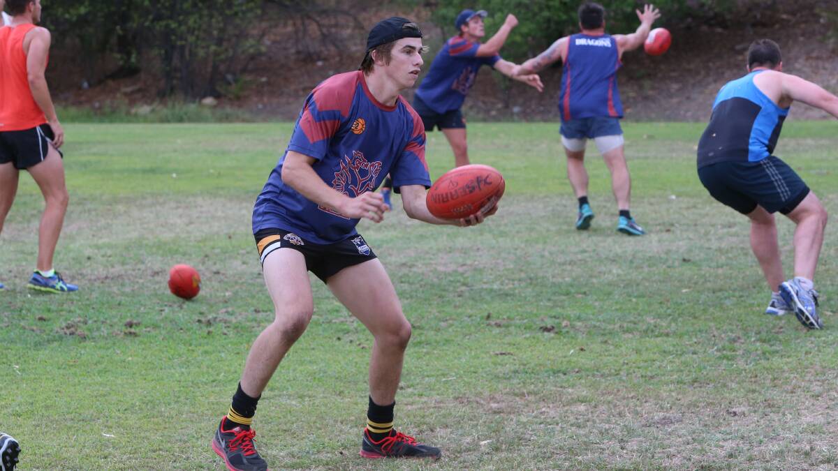Lachlan Ross prepares to fire off a handpass. Picture: PETER WEAVING 