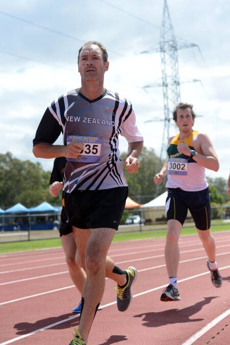 RECORD-BREAKER: Bruce Solomon races in the 1500m leg on his way to breaking the points tally for the 50-54 years division at the Oceania Masters athletics championships in Bendigo. Picture: LIZ FLEMING 