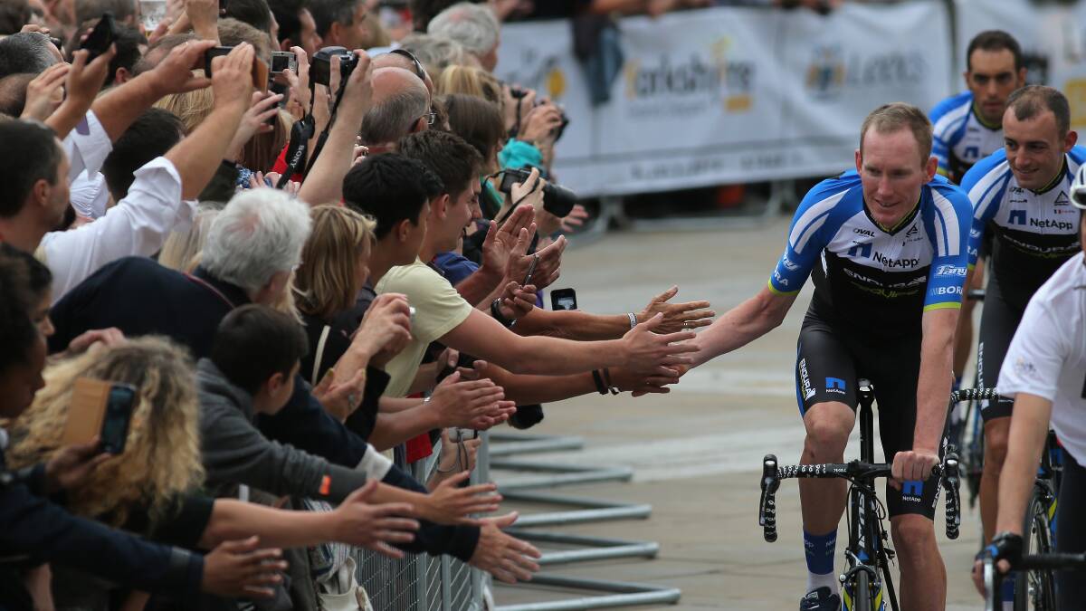 HIGH-FIVE: Zak Dempster acknowledges fans before the start of a stage in the Tour de France. Picture: GETTY 