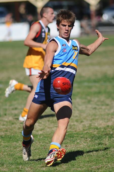 Matthew Ladson kicks in the clash with Dandenong Stingrays at the QEO in 2009. 