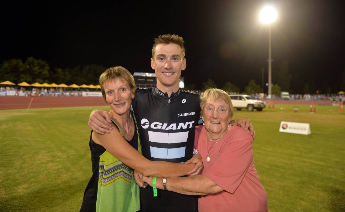 CLOSE-KNIT: Sam Crome is embraced by his mother, Lyn, and grandmother Joan Purtill after the Bendigo International Madison. Picture: BRENDAN McCARTHY