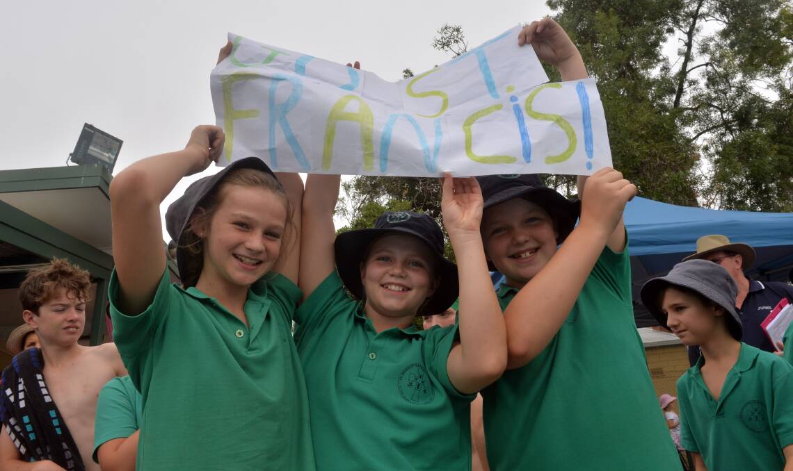 Maisy Harrop, Cailin Green and Poppy Skipper support their St Francis of the Fields team-mates. Picture: BRENDAN McCARTHY