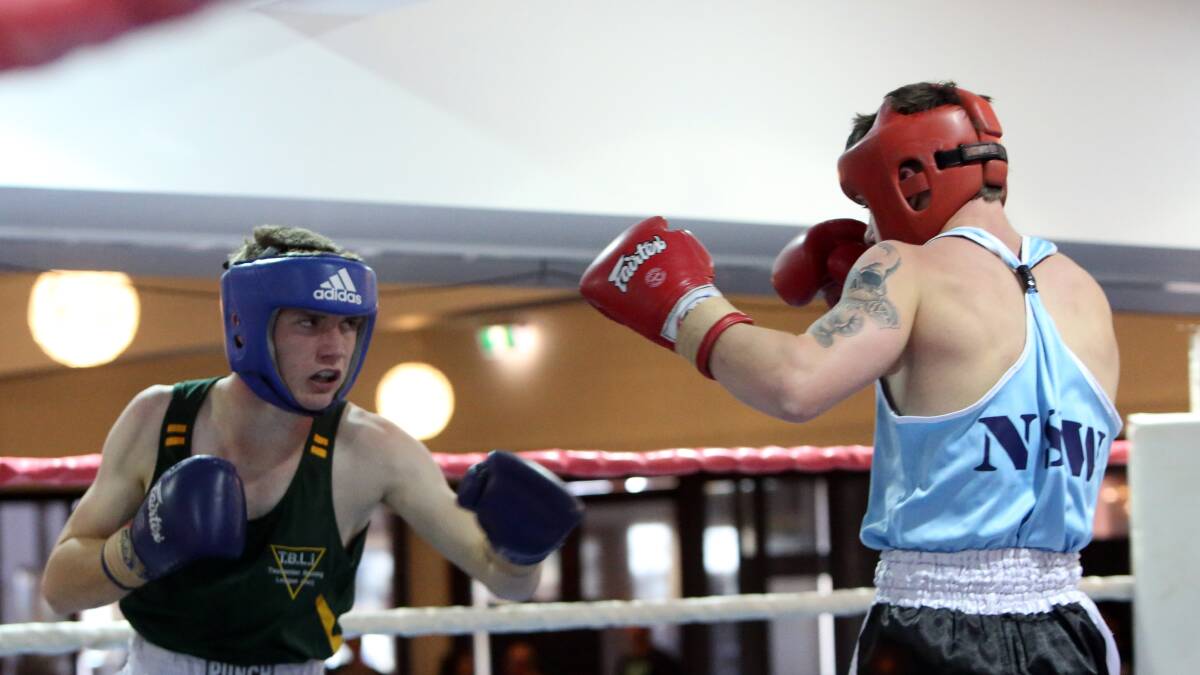 FOCUSED: Tasmania's Tyler Thornton takes on Corey Pyle from New South Wales in the junior 63kg final at the Australian Amateur Boxing League national titles in Bendigo. Picture: LIZ FLEMING