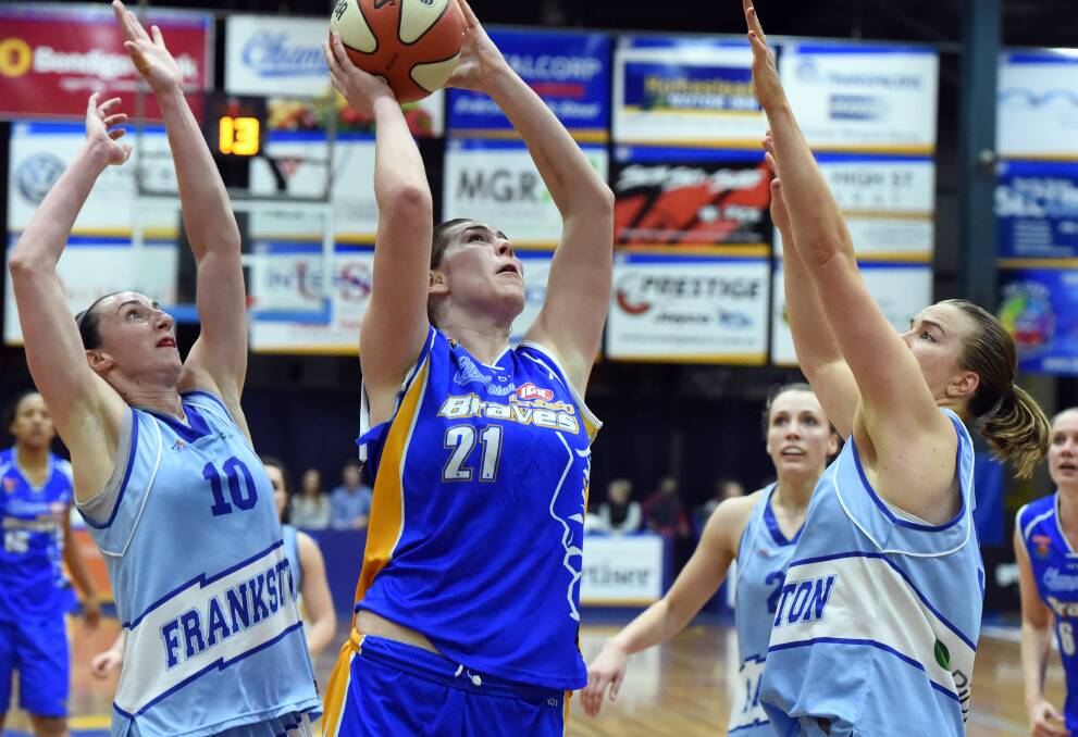 HOT HANDS: Alex Bunton aims for the basket on her way to a team-high 22 points in the Bendigo Lady Braves semi-final win against Frankston Blues at Bendigo Stadium. Picture: LIZ FLEMING