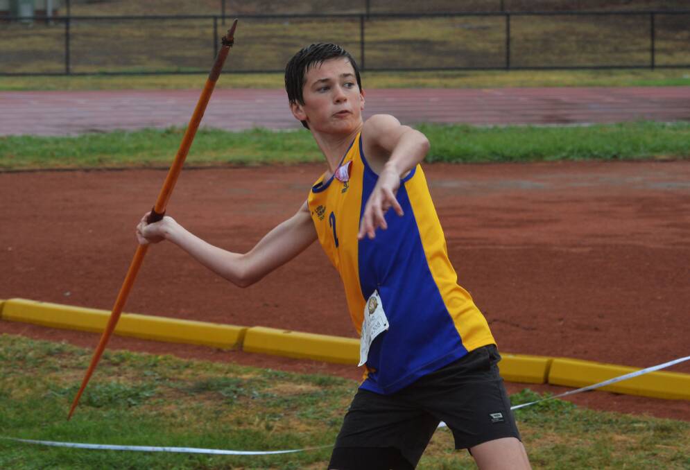 Jack Rule competes in the under-14 javelin. 