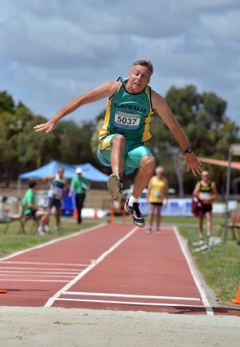 DETERMINATION: Dave Varley competing in the 50-54 years decathlon. Picture: BRENDAN McCARTHY 