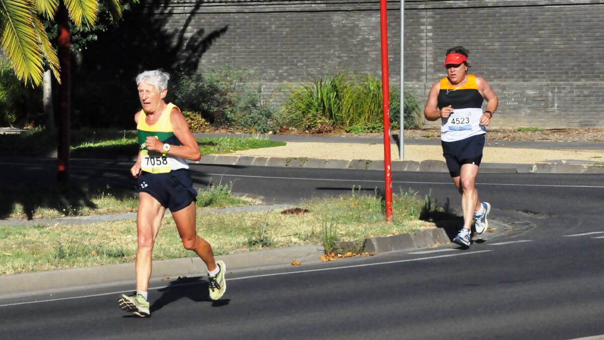 GOING STRONG: Lavinia Petrie races along Chapel Street. Picture: Greg Hilson