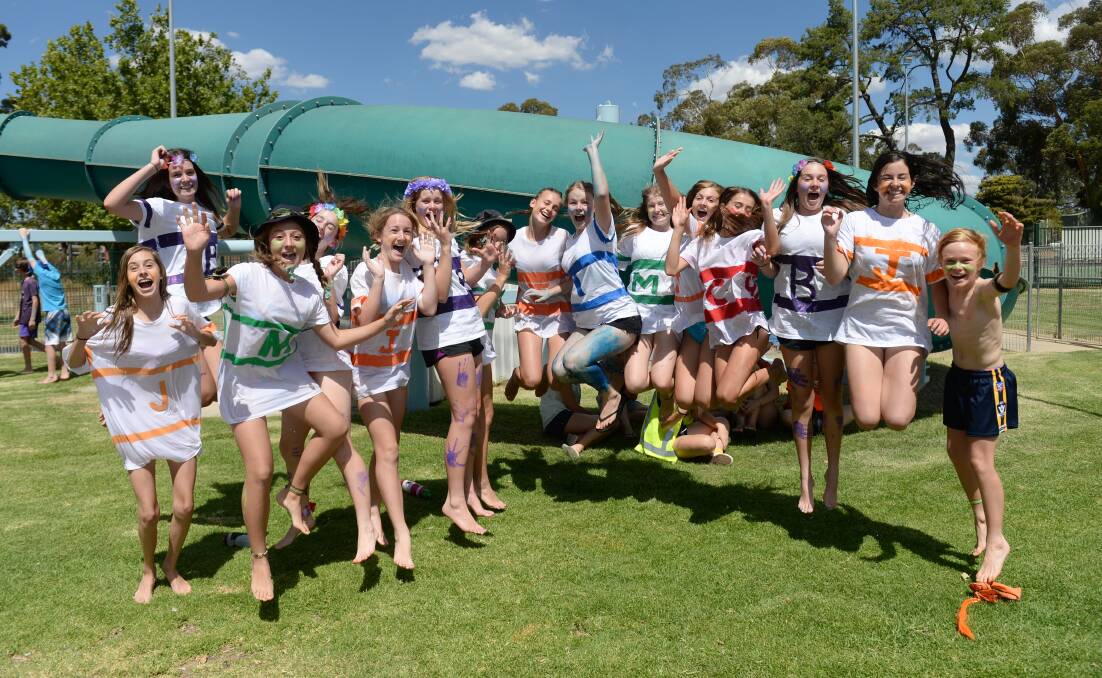 Students from year 8 get into the spirit at Catholic College Bendigo's swimming carnival. Pictures: JODIE DONNELLAN