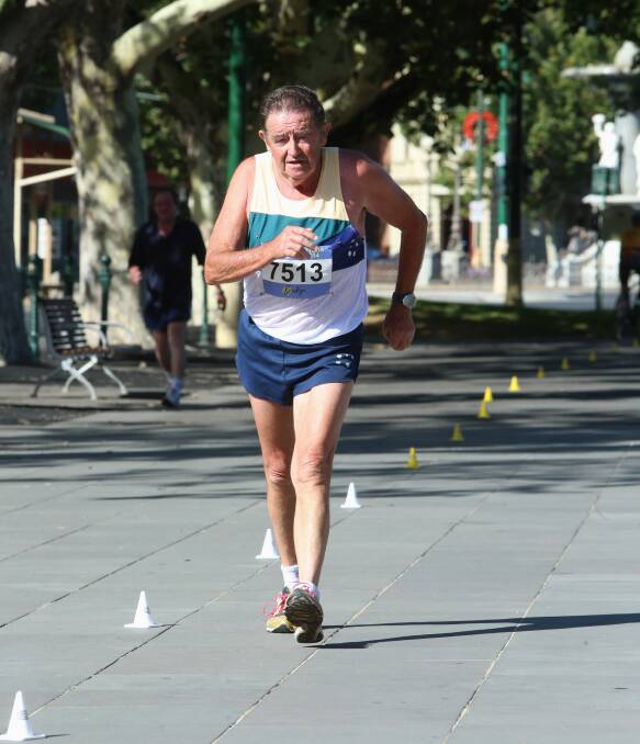 THE MAJOR: Eaglehawk's Geoff Major powers to the finish of the 10km walk as he competes in the 75-79 years class at the Oceania Masters athletics championships in Bendigo. Picture: PETER WEAVING 