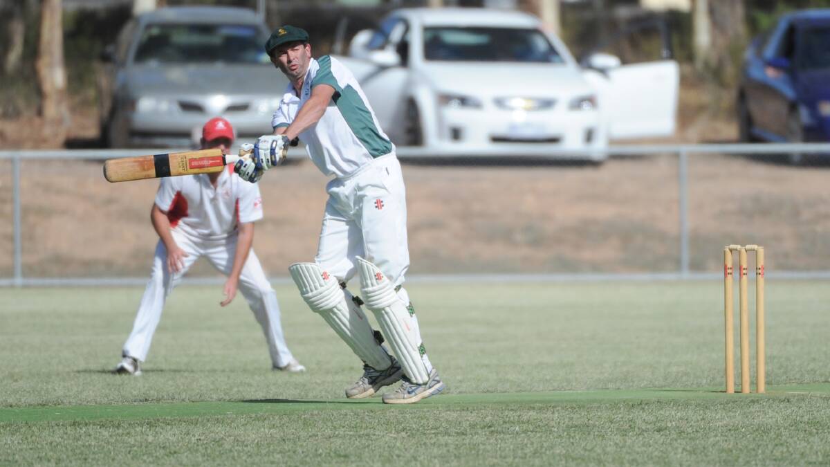 Tim Hobbs belts another boundary for Emu Creek in the Emu Valley Cricket Association's division one grand final in 2013. 