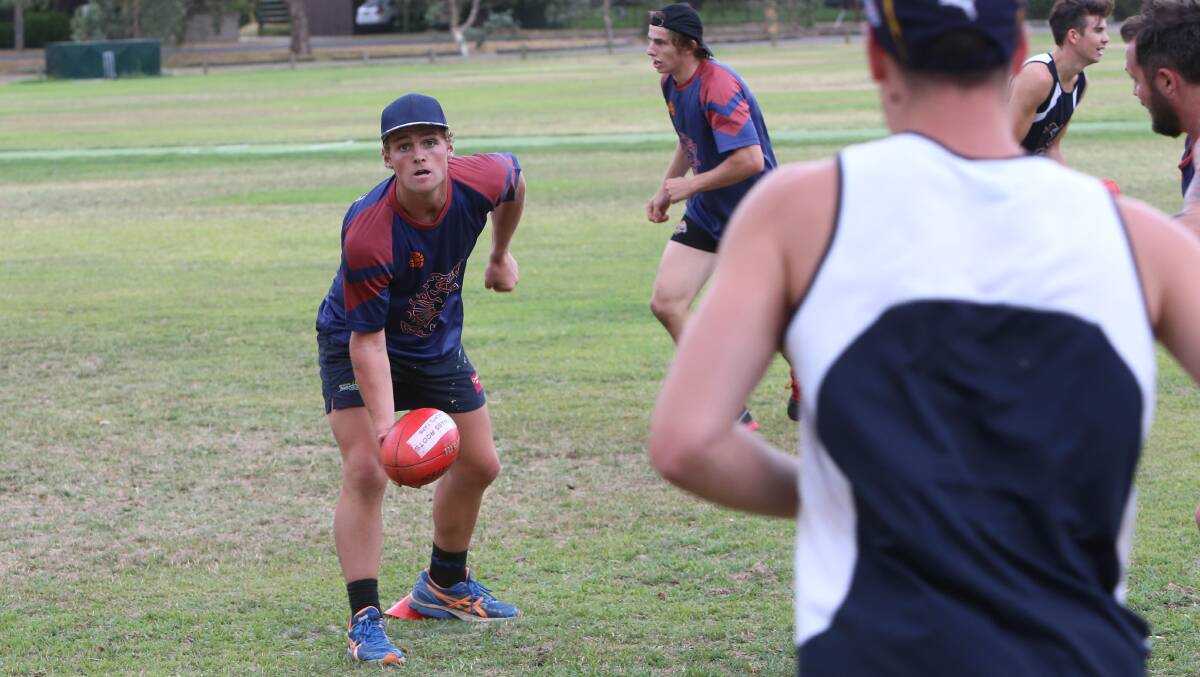 Seb Greene handpasses at the Dragons workout. Picture: PETER WEAVING 