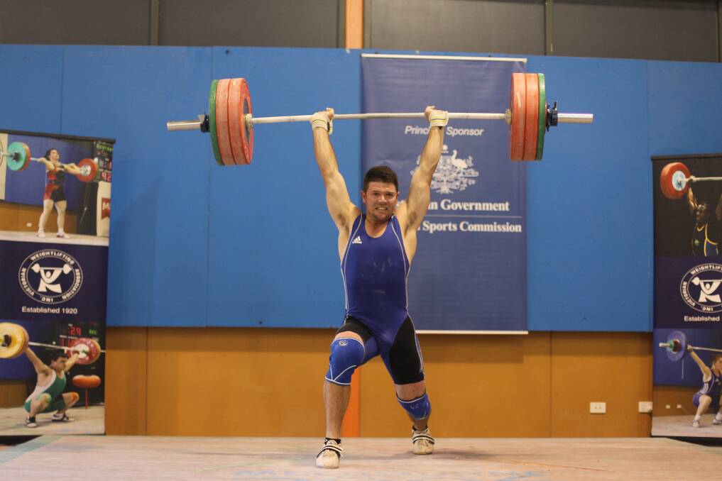 STRENGTH: Troy Hewkins on his way to victory in the 85kg class at this year's Victorian weightlifting championships. 