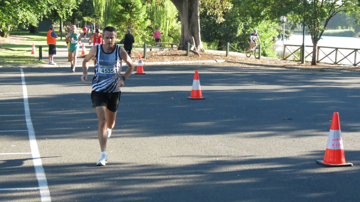 New Zealand's Will Twiss races around Lake Weeroona in the Oceania Masters half-marathon in Bendigo. Picture: HUNTER GILL 
