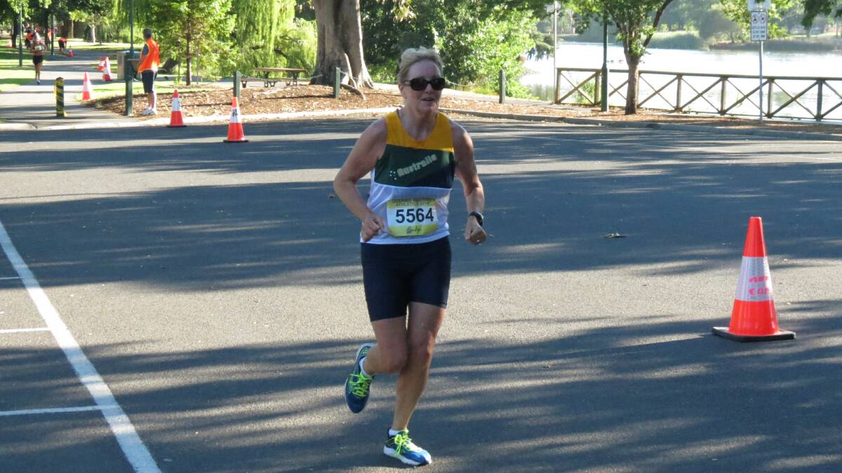 Helen Stanley runs the Lake Weeroona leg in the half-marathon at the Oceania Masters athletics titles in Bendigo. Picture: HUNTER GILL 