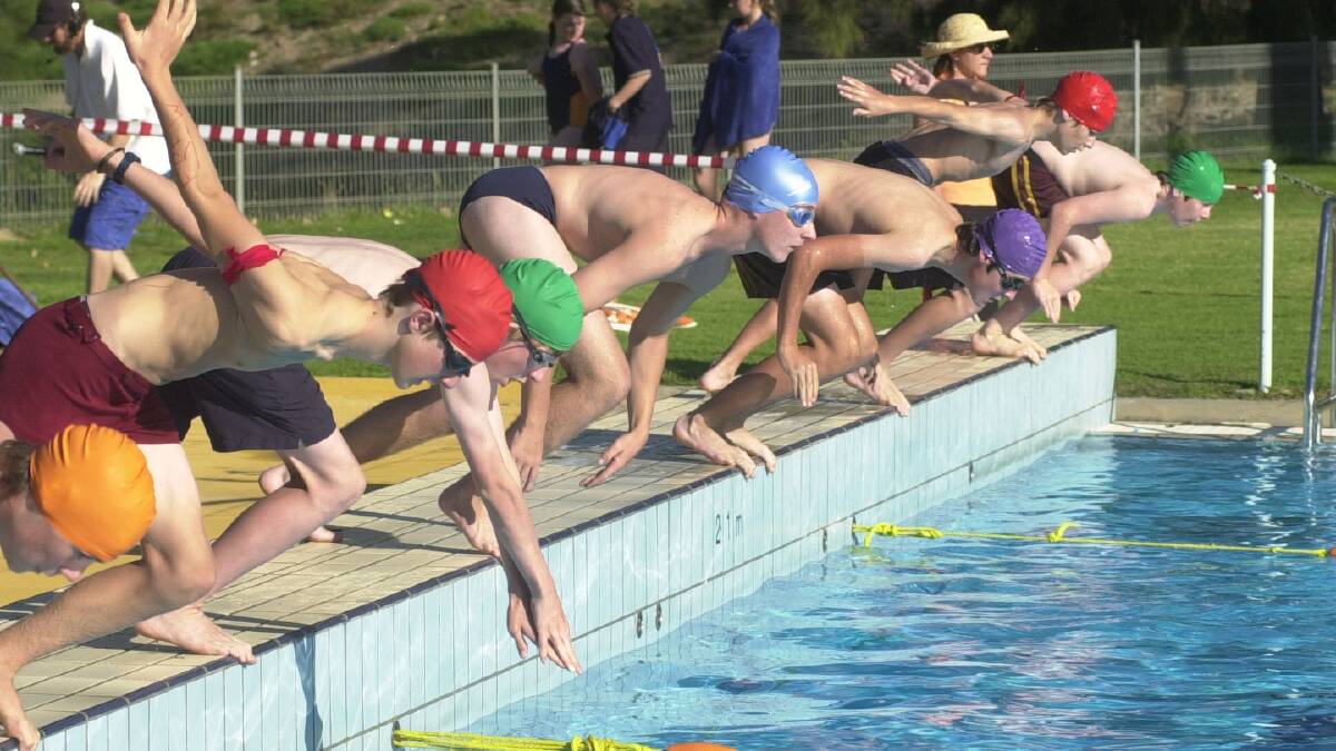 Girton Grammar students dive in for the start of a 50m freestyle final at Girton Grammar's swimming carnival in 2005. 