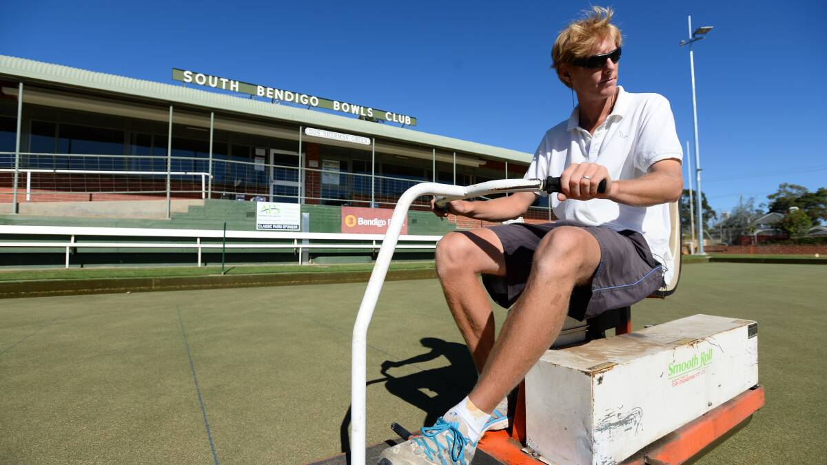ROLLING ON: South Bendigo's chief greenkeeper Brent Veale continues preparations for Sunday's Bendigo Bowls Division grand finals. Picture: JIM ALDERSEY