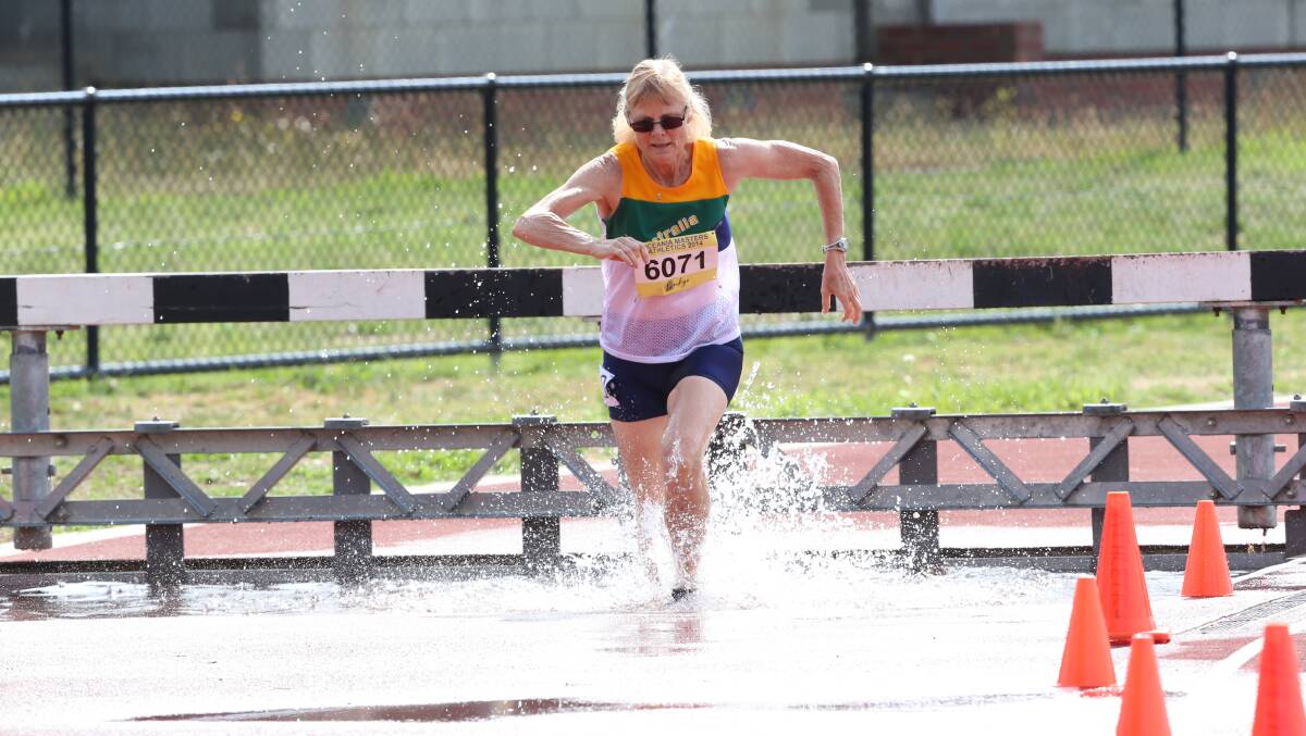 Margaret Saunders races to victory in the 60-64 years 2000m steeplechase on the final day of track and field action at the Oceania Masters athletics championships in Bendigo. Picture: LIZ FLEMING