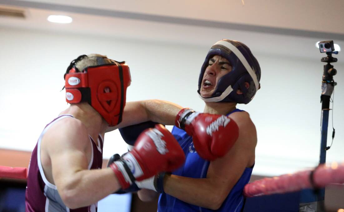GREAT BATTLE: Queensland's Benjamin Kurman takes on Victoria's Erin Mehmet in the junior 71kg final at the Australian Amateur Boxing League national championships in Bendigo. Picture: LIZ FLEMING