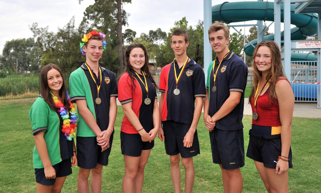 Age group champions Alexandra Liacos and Matthew Slot (16-years); Zoe Deed and Michael Valentine (17-years); Jacob Waller and Emajane Fisher (20-years). 