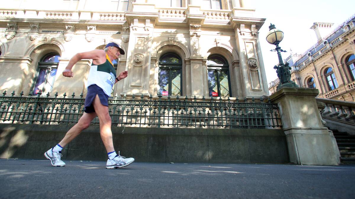 HISTORIC LANDMARK: Bendigo's Norm West powers past the old Post Office as he competes in the 10km walk at the Oceania Masters athletics championships in Bendigo. Picture: PETER WEAVING 