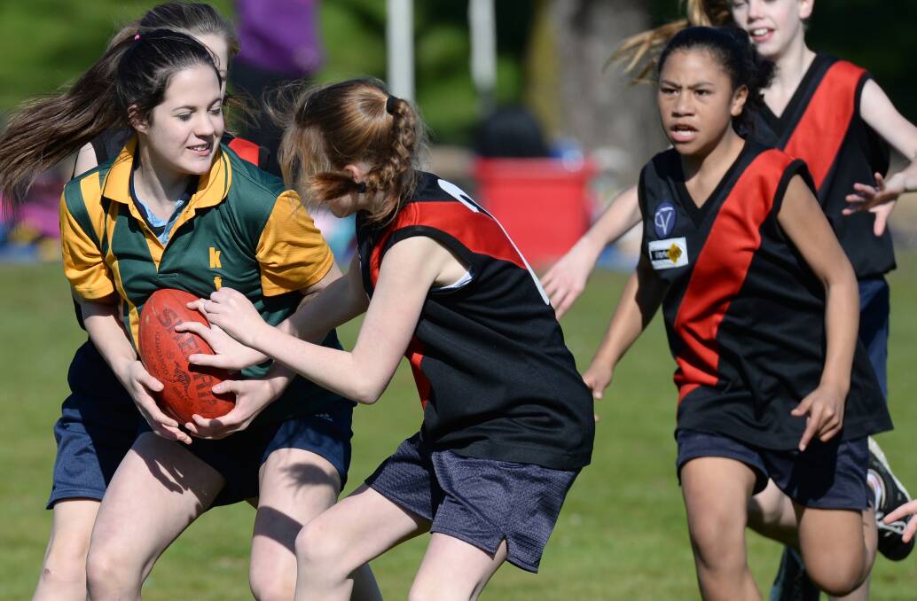 IT'S MINE: Maiden Gully takes on White Hills in the SSV primary schools carnival.