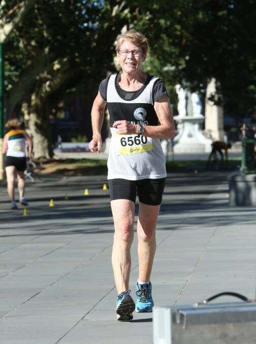 ALL SMILES: New Zealand's Barbara Morrison contests the 10km walk at the Oceania Masters athletics championships in Bendigo. Picture: PETER WEAVING 