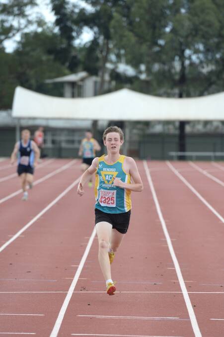 Nathan Green from Bendigo Harriers wins his 300m heat in 47.33 seconds. 