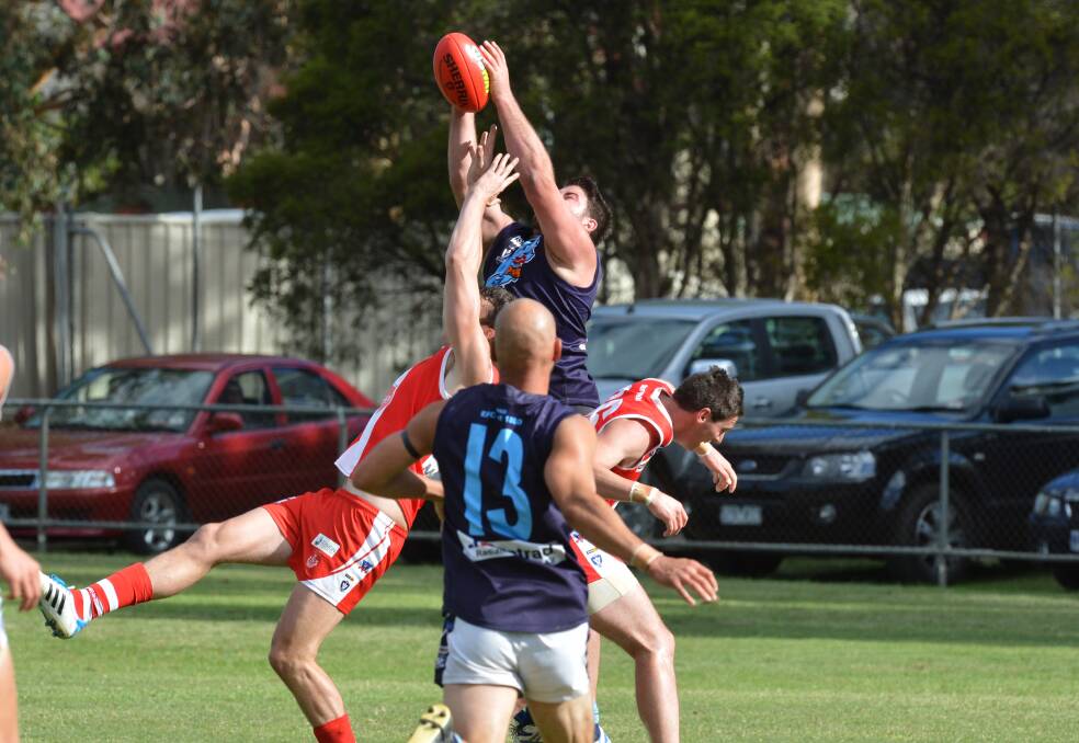 TOO STRONG: Eaglehawk's Matt Gilmore wins this contest in the Easter Saturday match against South Bendigo at Kennington's Harry Trott Oval. Picture: PETER WEAVING 