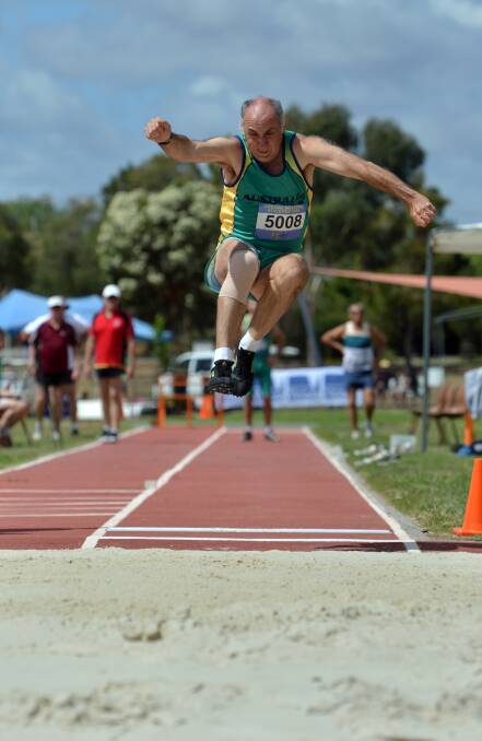 MULTI-TALENTED: Tony Dell contests long jmp in the 50-54 years decathlon at the Oceania Masters athletics titles in Bendigo. Picture: BRENDAN McCARTHY 