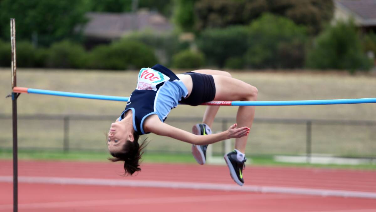 UP AND OVER: Denise Snyder contests high jump. Picture: LIZ FLEMING