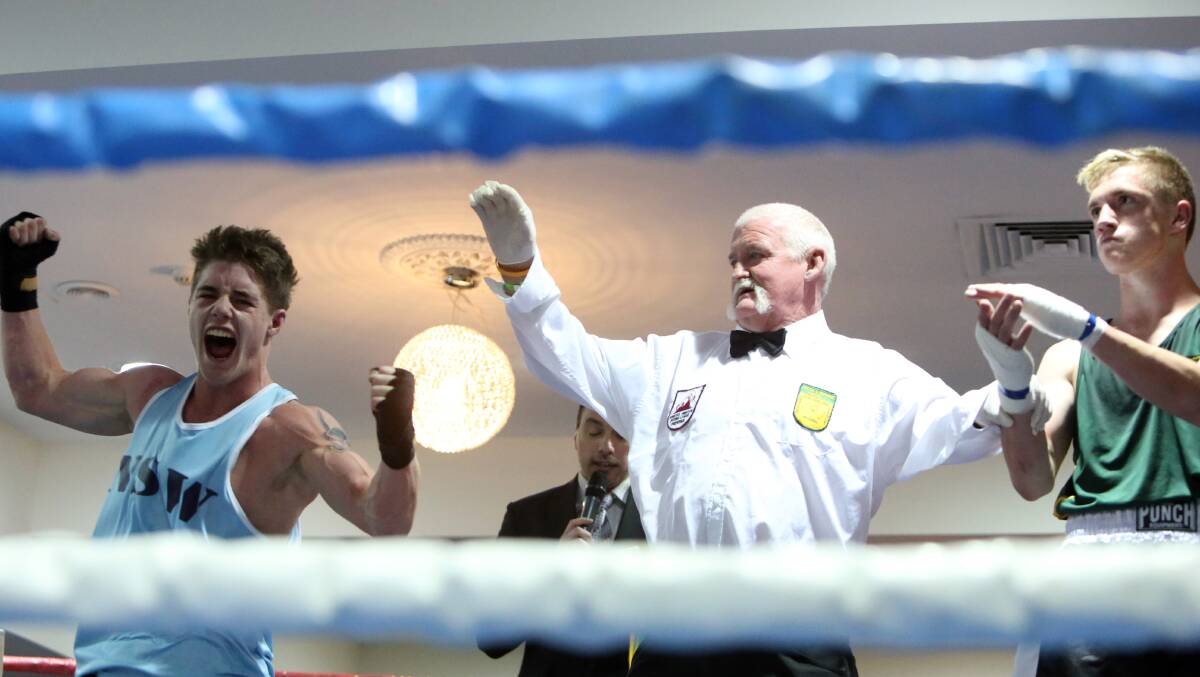 ECSTATIC: Corey Pyle from New South Wales celebrates after winning the junior 63kg final against Tasmania's Tyler Thornton at the Australian Amateur Boxing League national championships in Bendigo. Picture: LIZ FLEMING